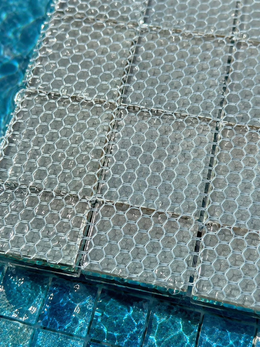 Mosaic mesh backing adhesive close-up